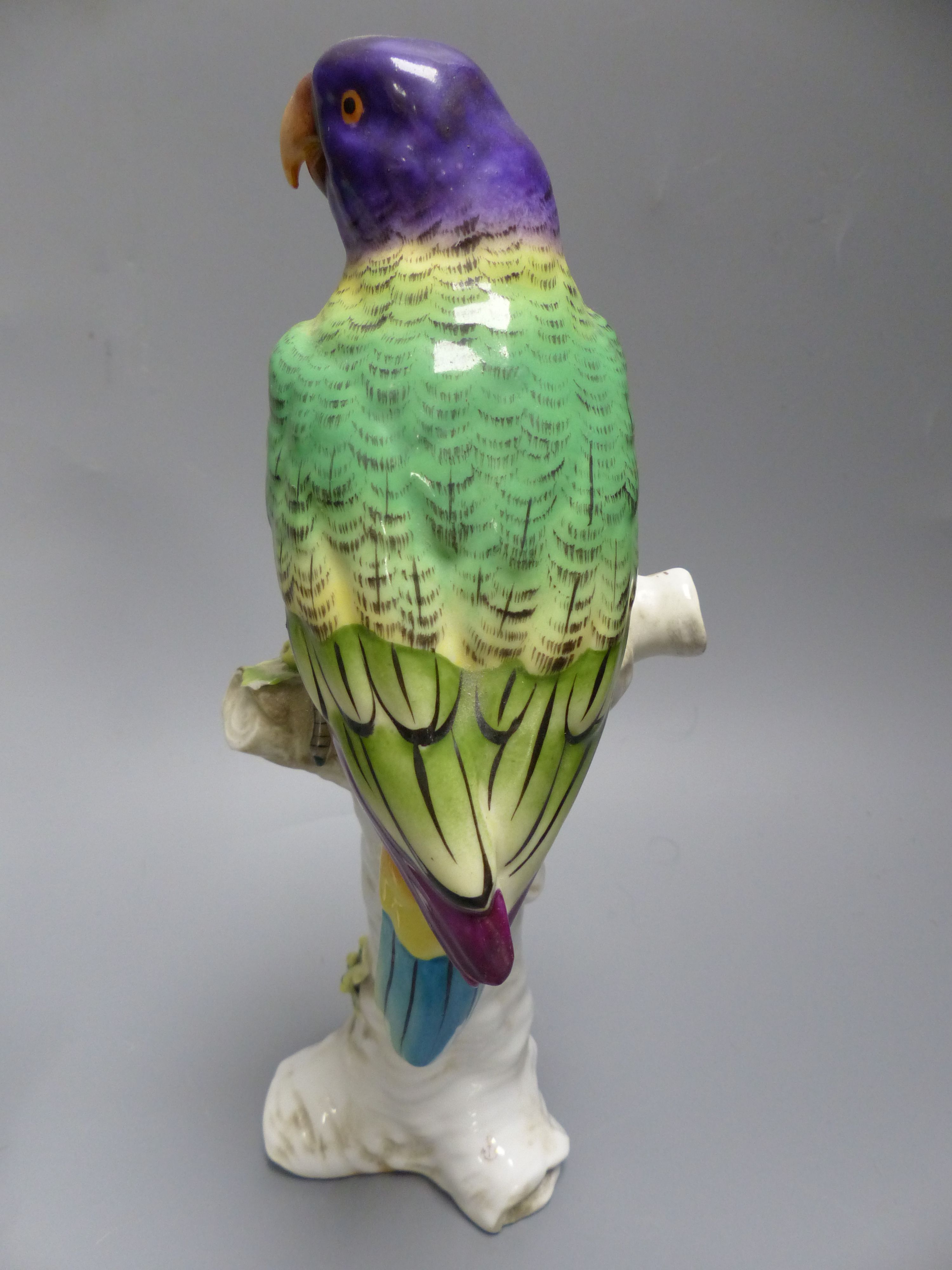 Two Continental porcelain models of parakeets, height 23.5cm